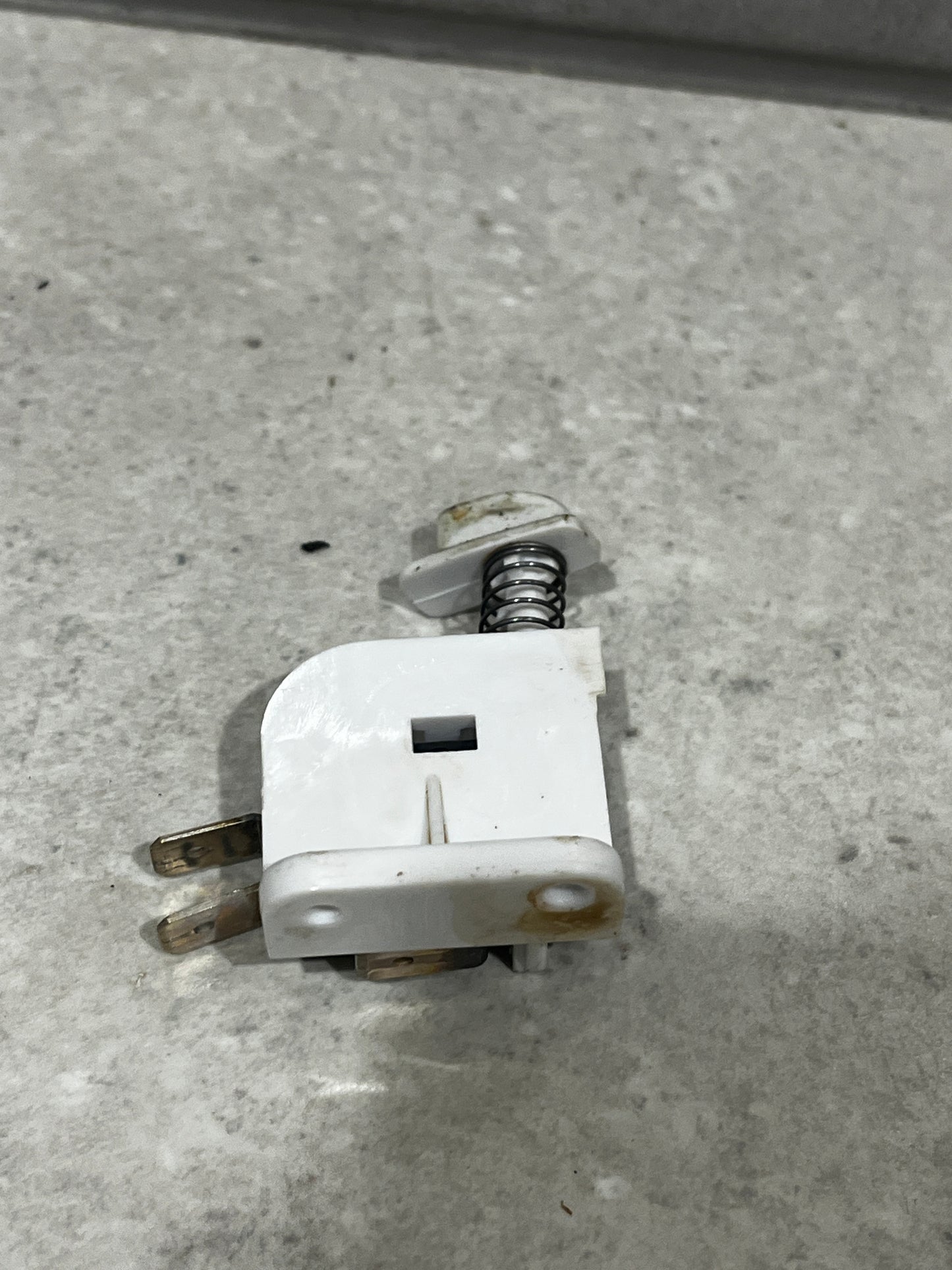 Side view of SM-53F micro switch assembly highlighting spring mechanism and mounting base