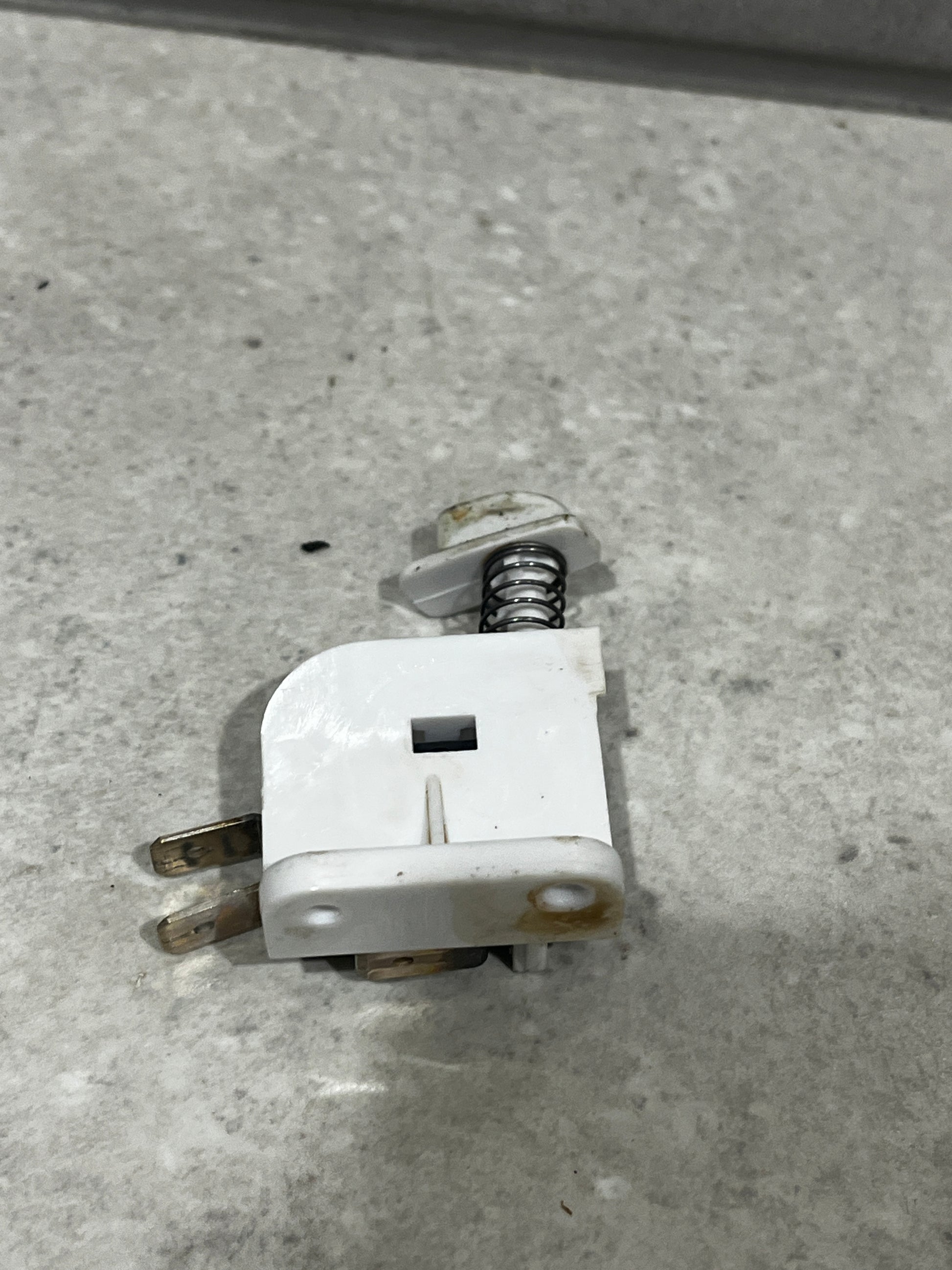 Side view of SM-53F micro switch assembly highlighting spring mechanism and mounting base