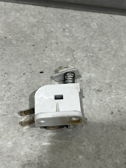 Side view of SM-53F micro switch assembly highlighting spring mechanism and mounting base