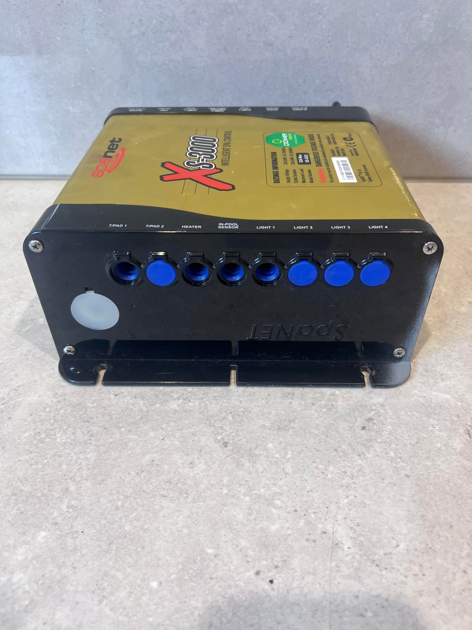Side view of SpaNet XS-3000 Intelligent Spa Controller with blue connection ports