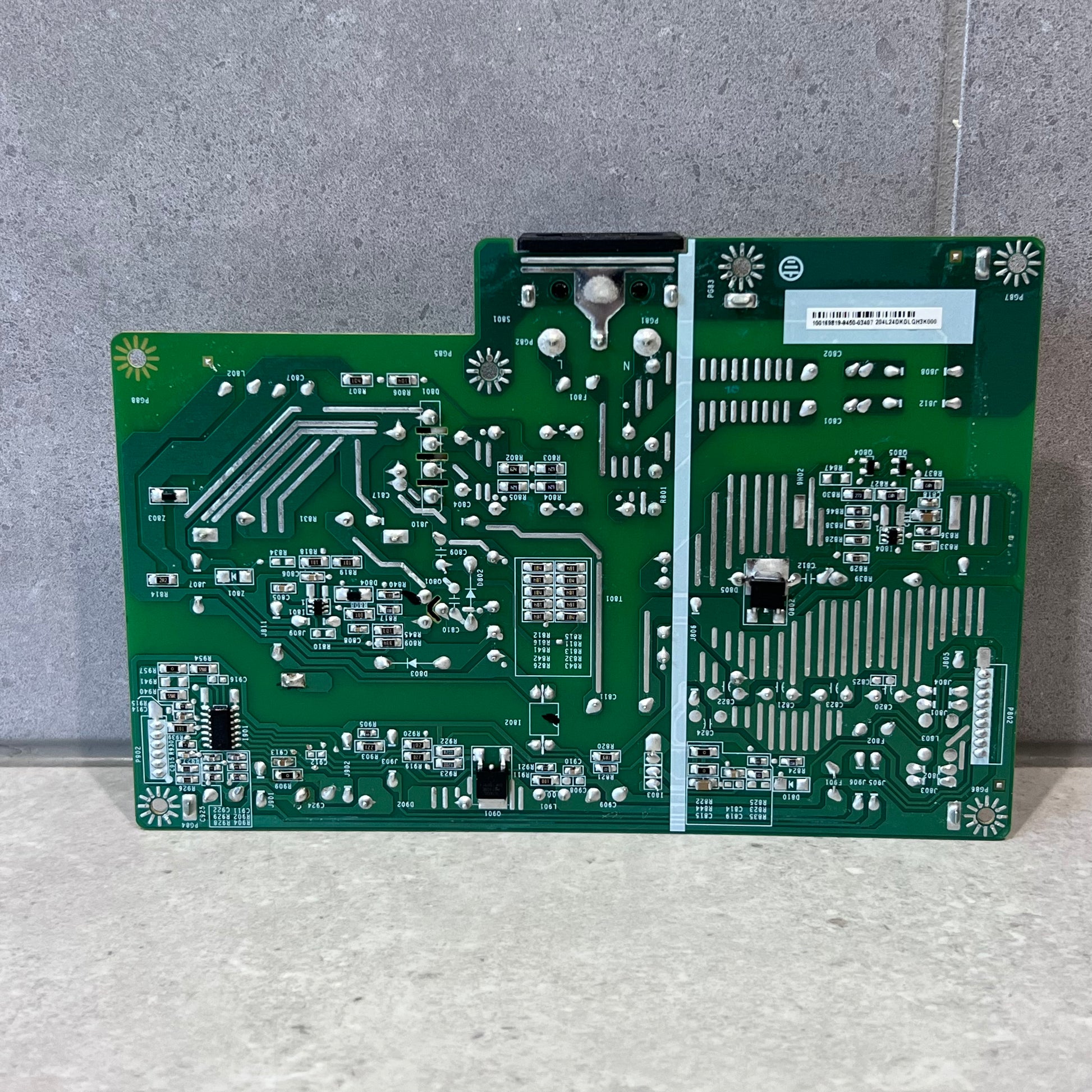 Power supply PCB underside showing circuit traces and solder points