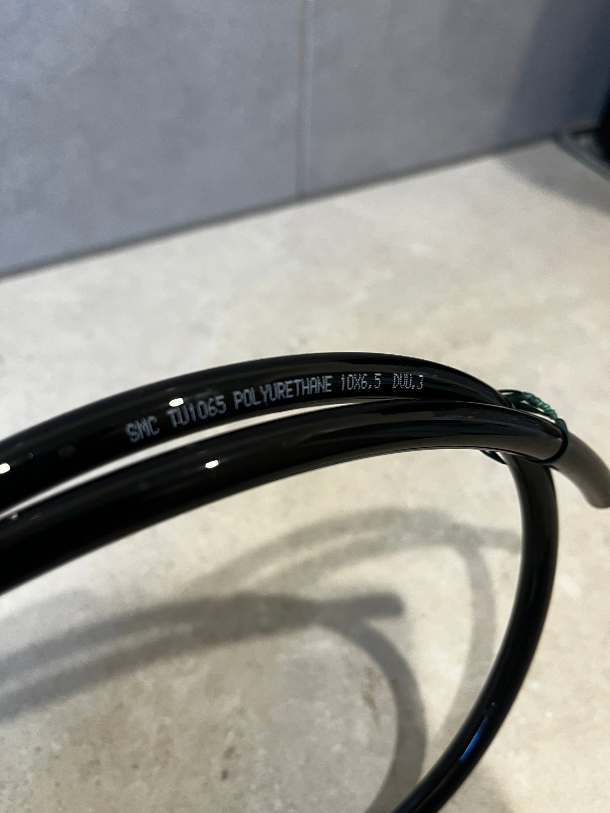 Close-up of polyurethane tubing with size and material details printed