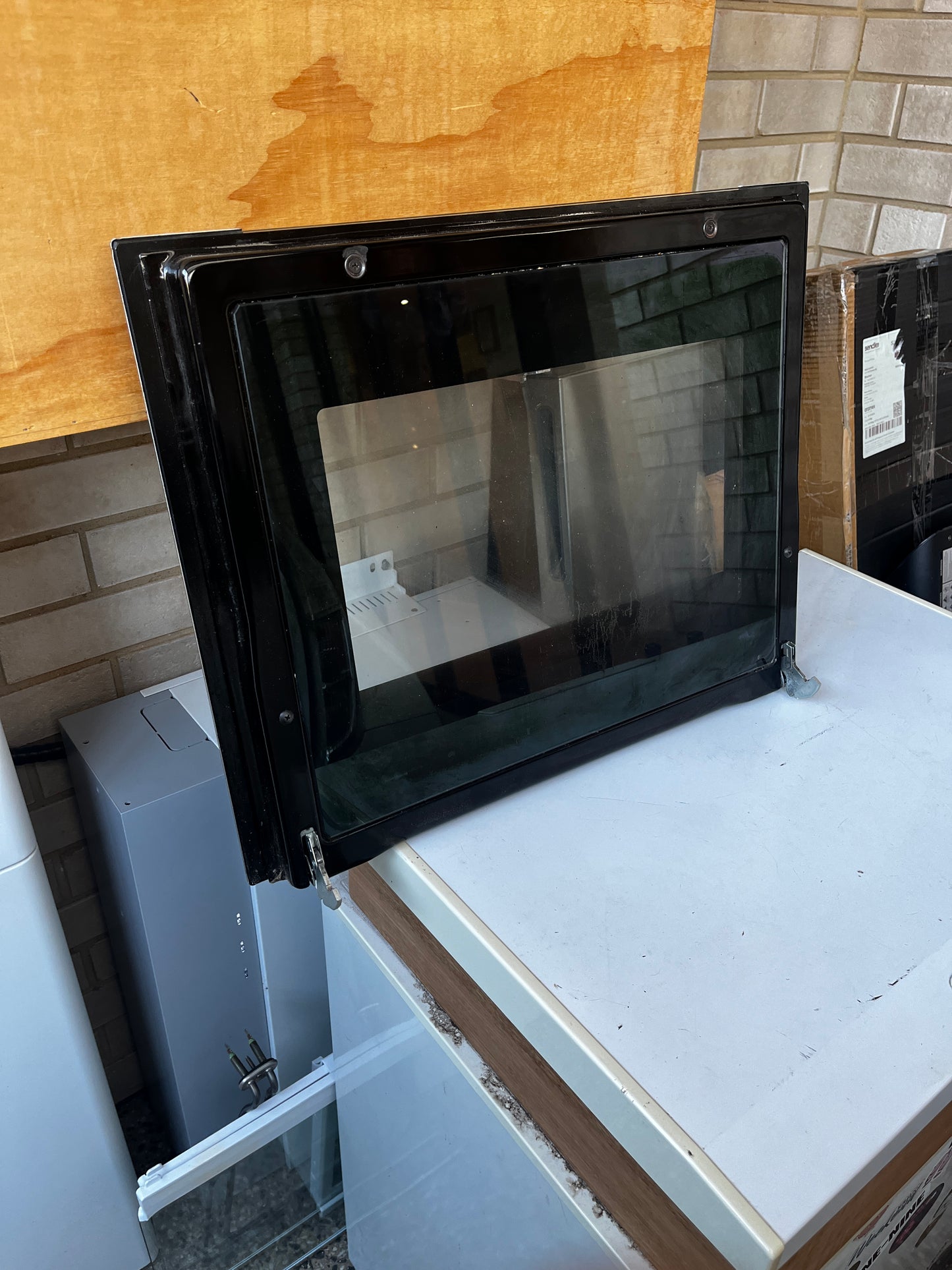 Back view of Euro oven door showing hinges and glass panel