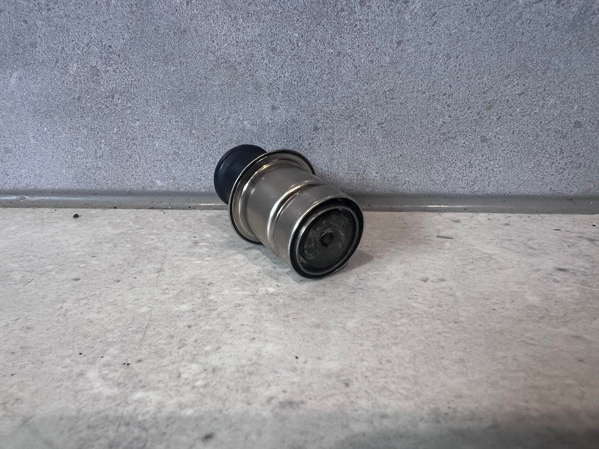Automotive cigarette lighter socket plug with metal casing and black tip, rear view