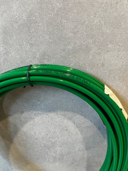 Close-up of green polyurethane tubing coil showing material and label