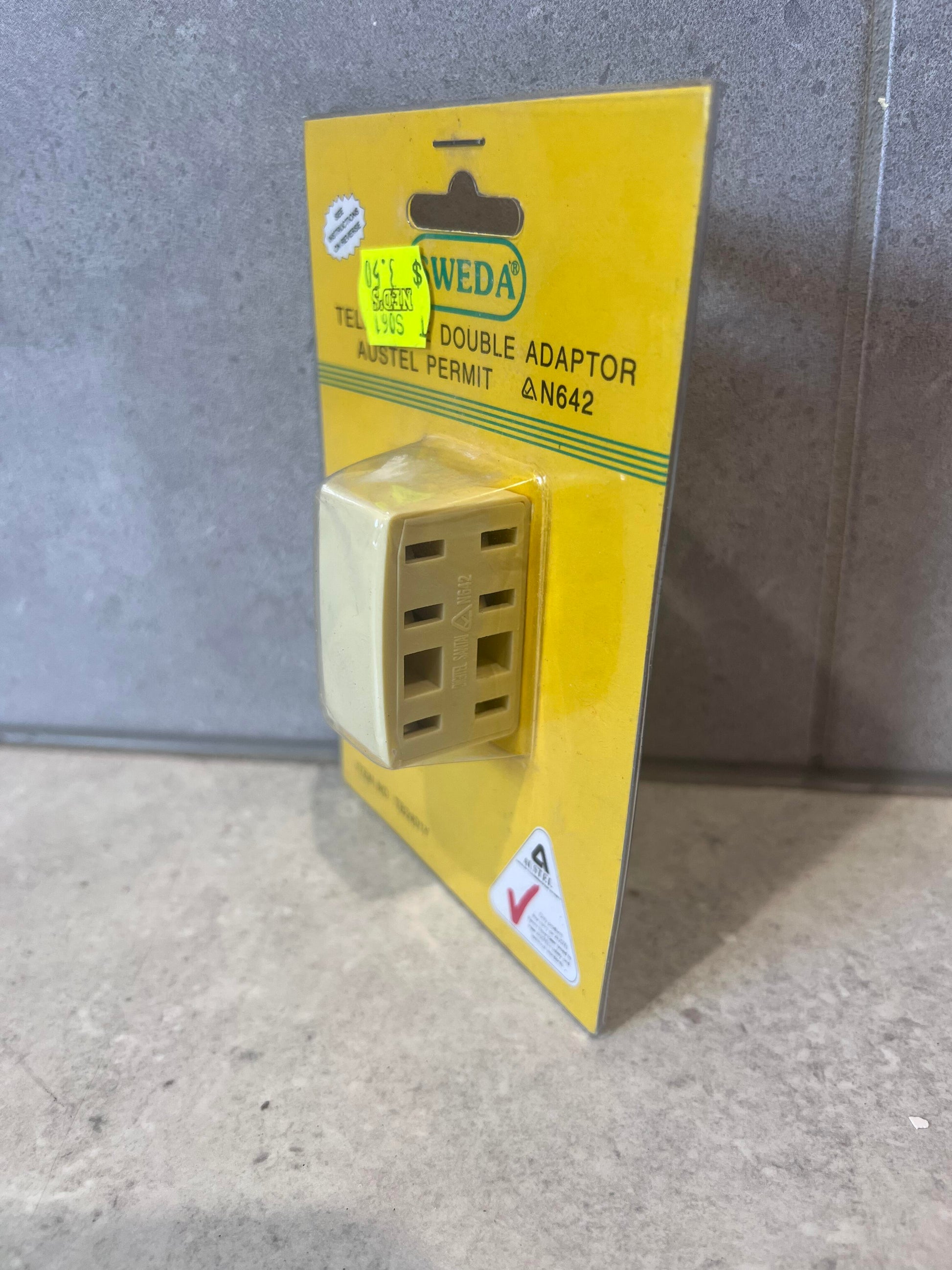 Angled side view of Sweda Telephone Double Adaptor showing dual ports