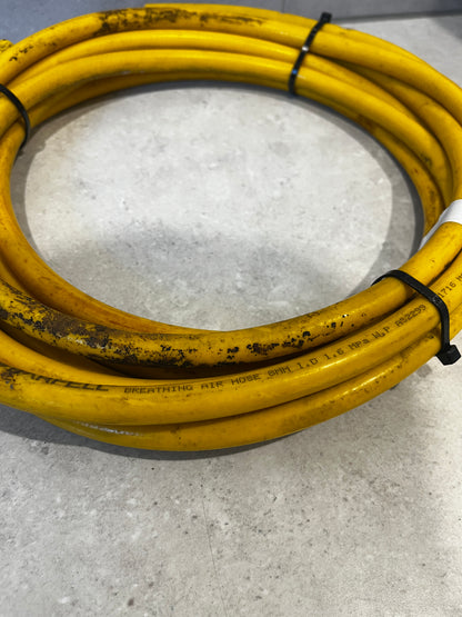 Close-up of yellow Barfell breathing air hose with visible wear and text on surface
