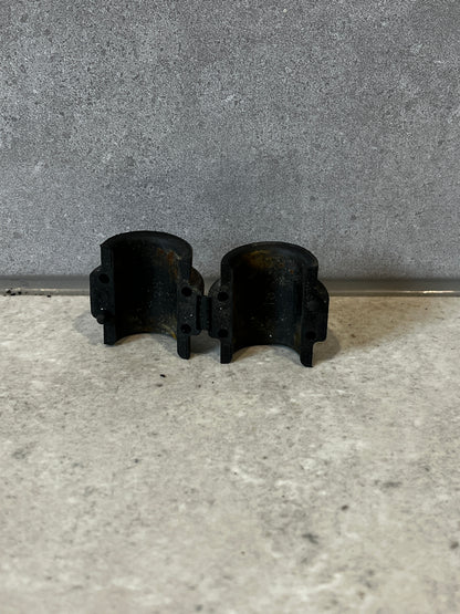 Bag containing multiple Armada 18mm black plastic bearing mounts