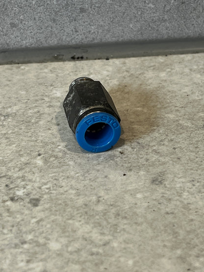 Front view of Festo pneumatic fitting with blue plastic collar, showing tube connection opening