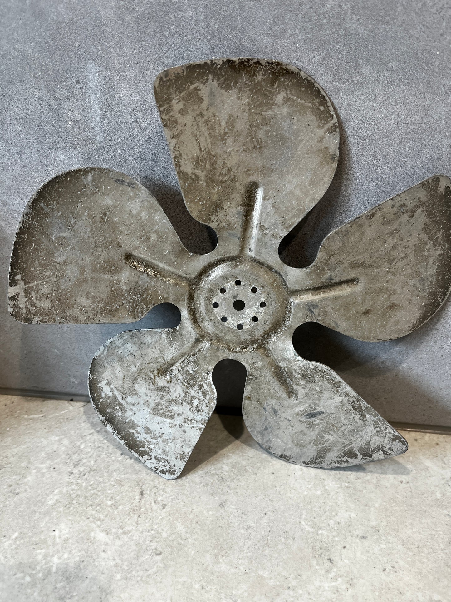 Weathered metal fan blade showing durability
