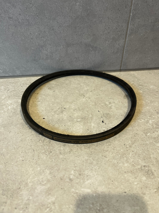 Single industrial V-belt laid flat on a countertop surface