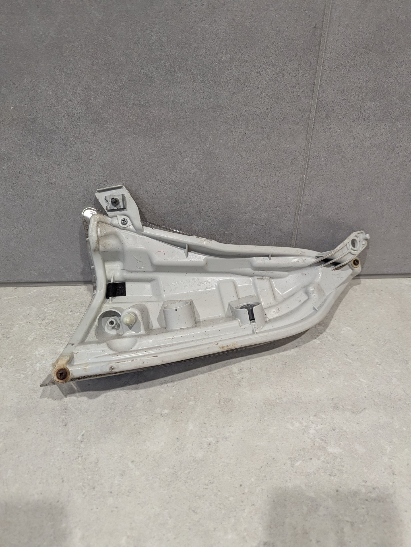 Rear view of right side marker light assembly showing mounting points and housing