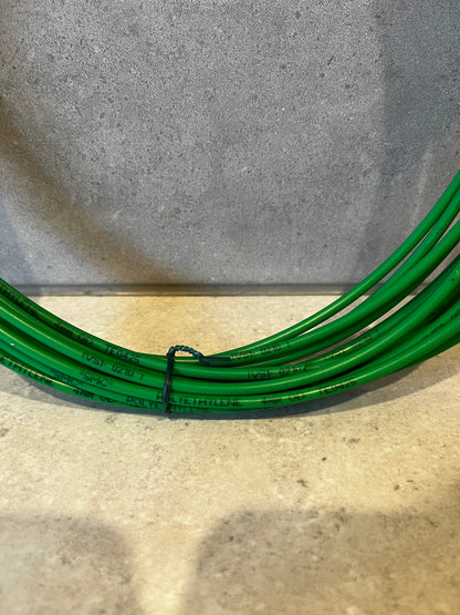 Close-up of green polyethylene wire showing 4mm diameter text