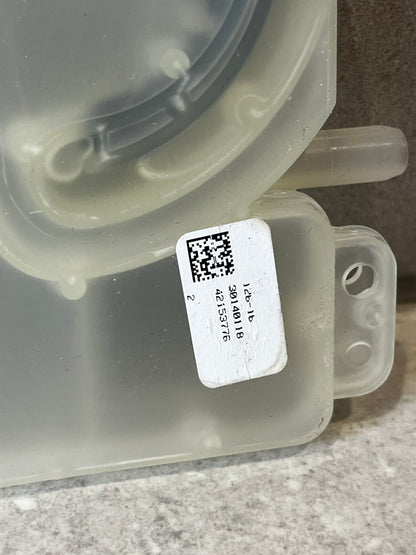 Close-up of dishwasher inlet valve with label and part number