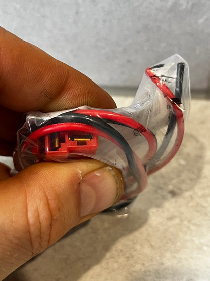 Close-up of heavy duty electrical wire harness connector showing terminals