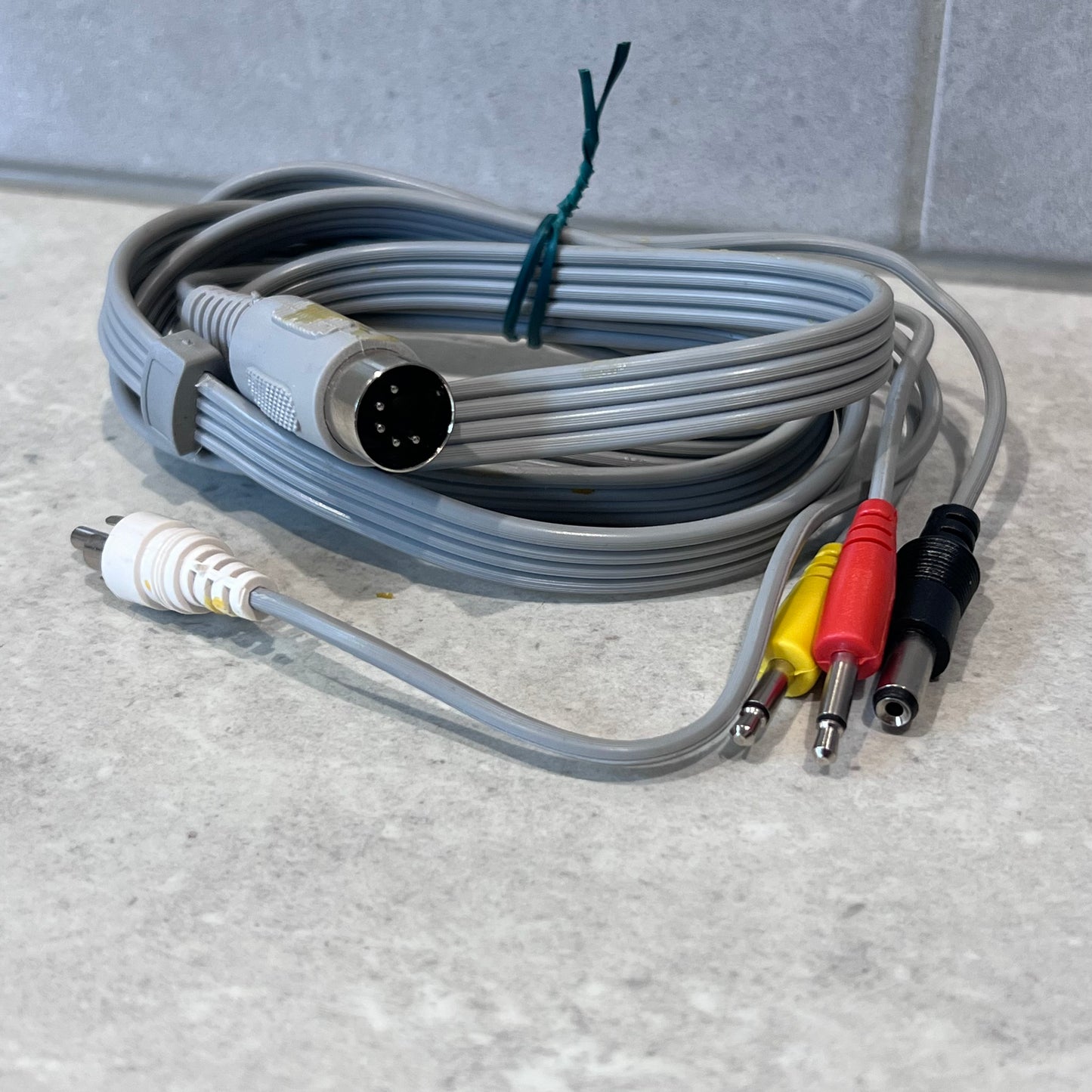 Close-up of 5 pin DIN Hi-Fi amplifier cable set with RCA, mono 3.5mm, and DC barrel connectors