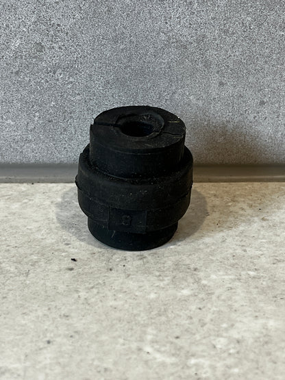 Single black rubber bush from Armada 28mm kit displayed upright