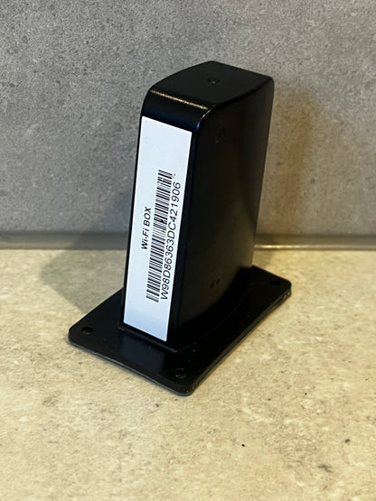 Wi-Fi receiver box with barcode label and mounting base on countertop