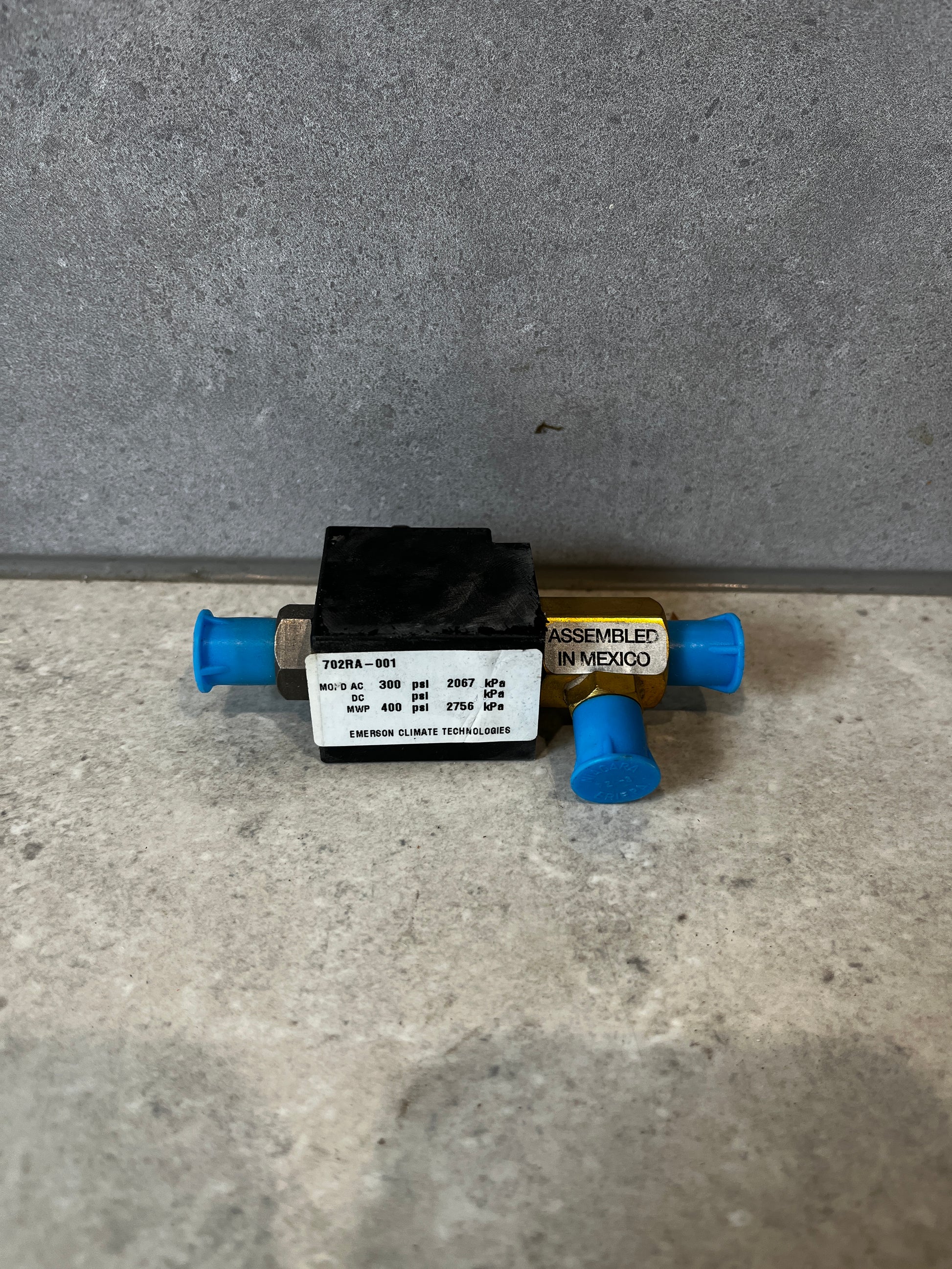 Rear view of Emerson 702RA-001 refrigeration solenoid valve showing pressure ratings