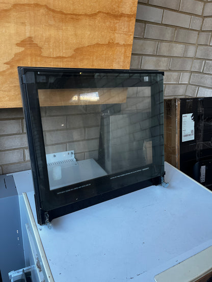 Side angle view of Chef oven door showing black frame and mounting brackets