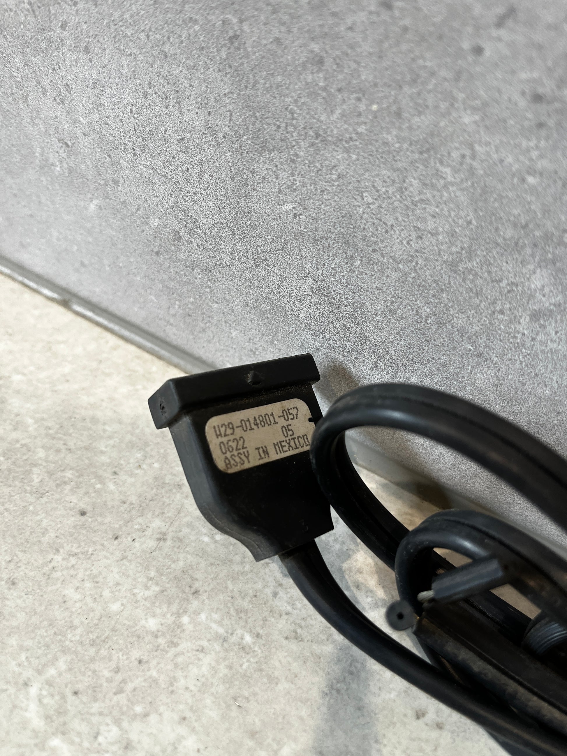 Close-up of power cord connector showing product label