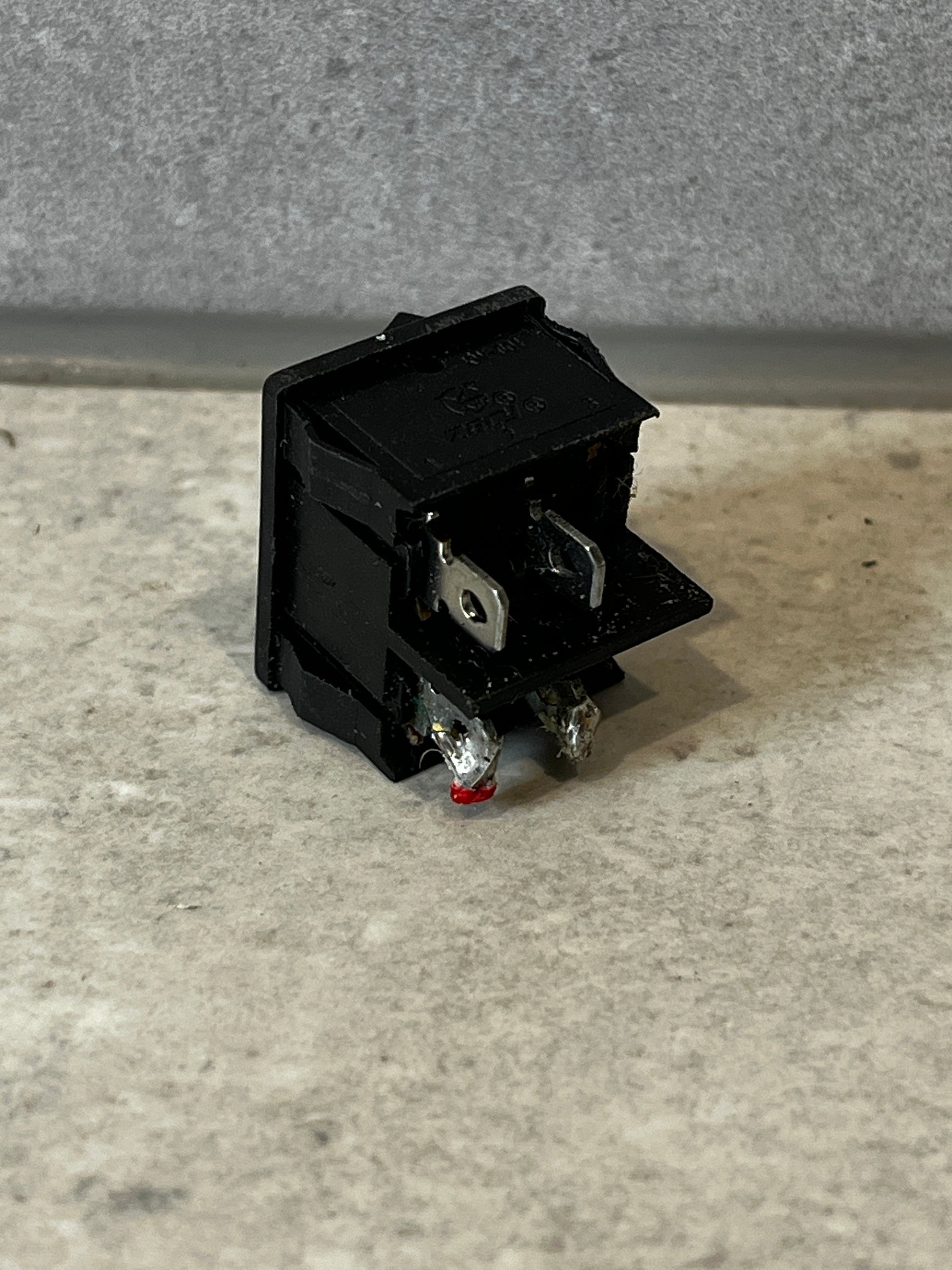Rear angle showing terminals of the black rocker switch