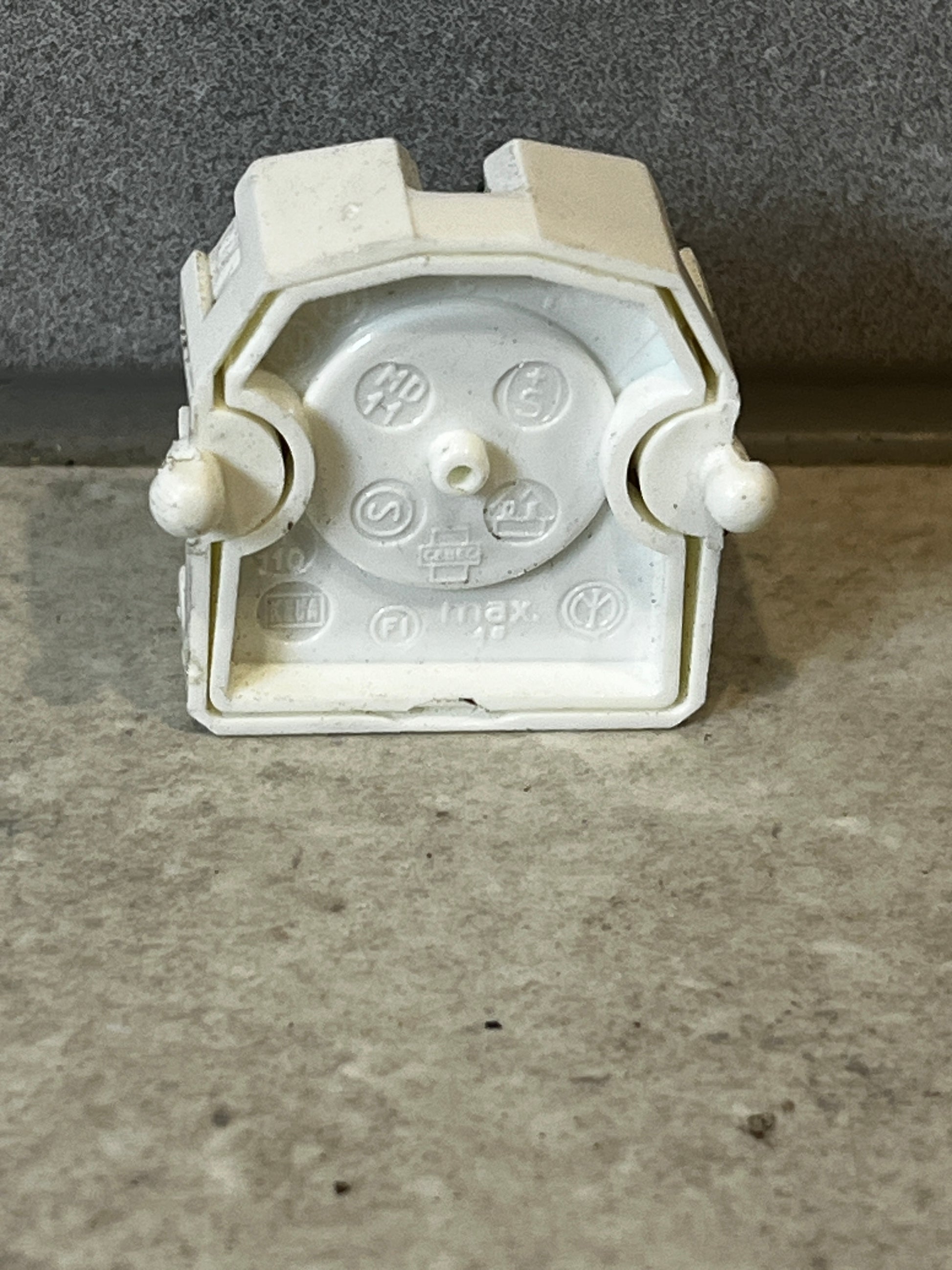 Back view of fluorescent lamp holder socket showing connection details