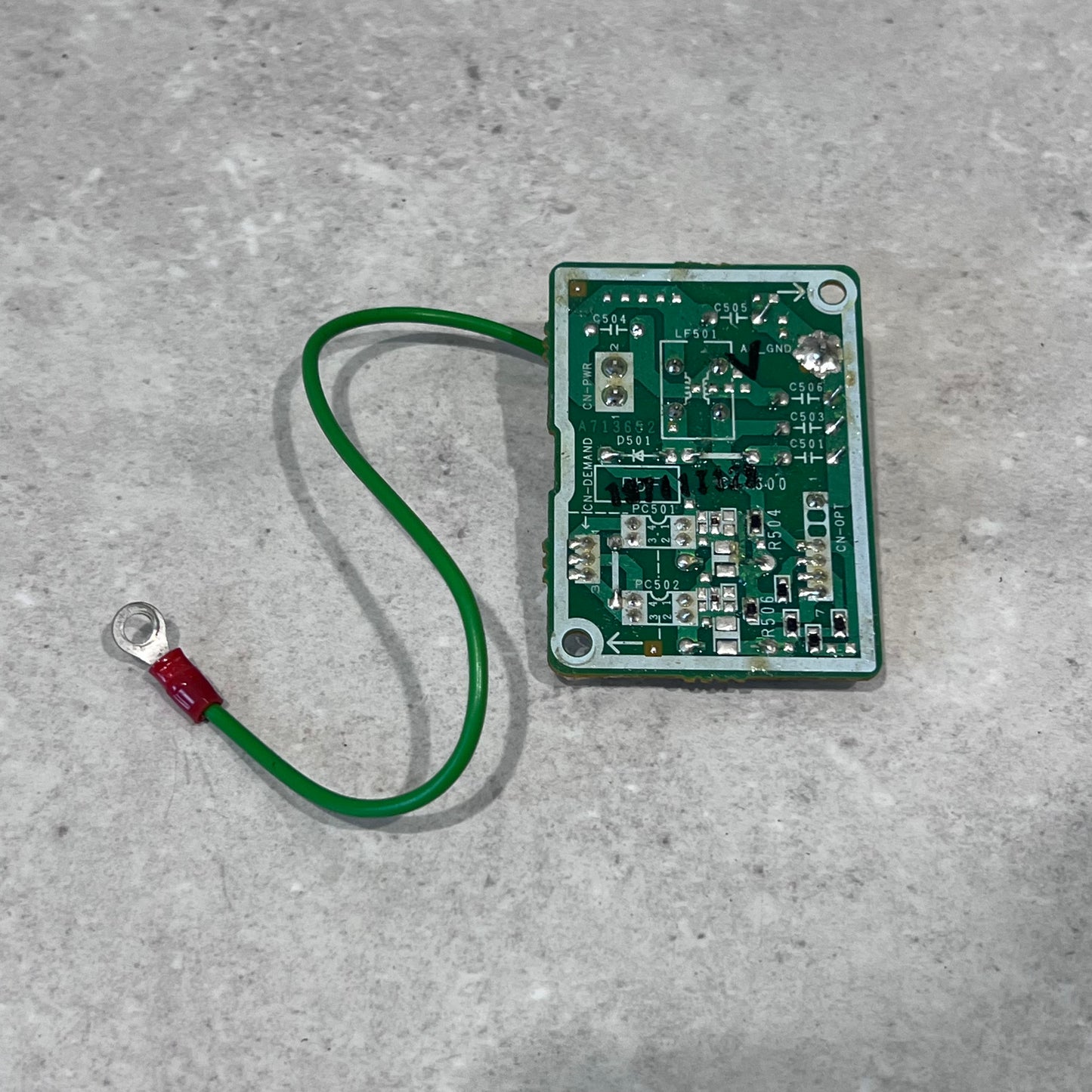 Back view of ACXA73-00070 circuit board module with green wire