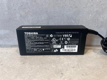 Close-up of Toshiba AC/DC adapter model PA3716E-1AC3 showing specifications