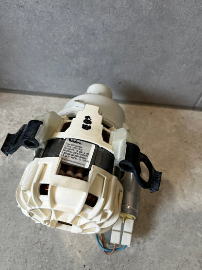 Label and wiring view of washing machine drain pump motor assembly