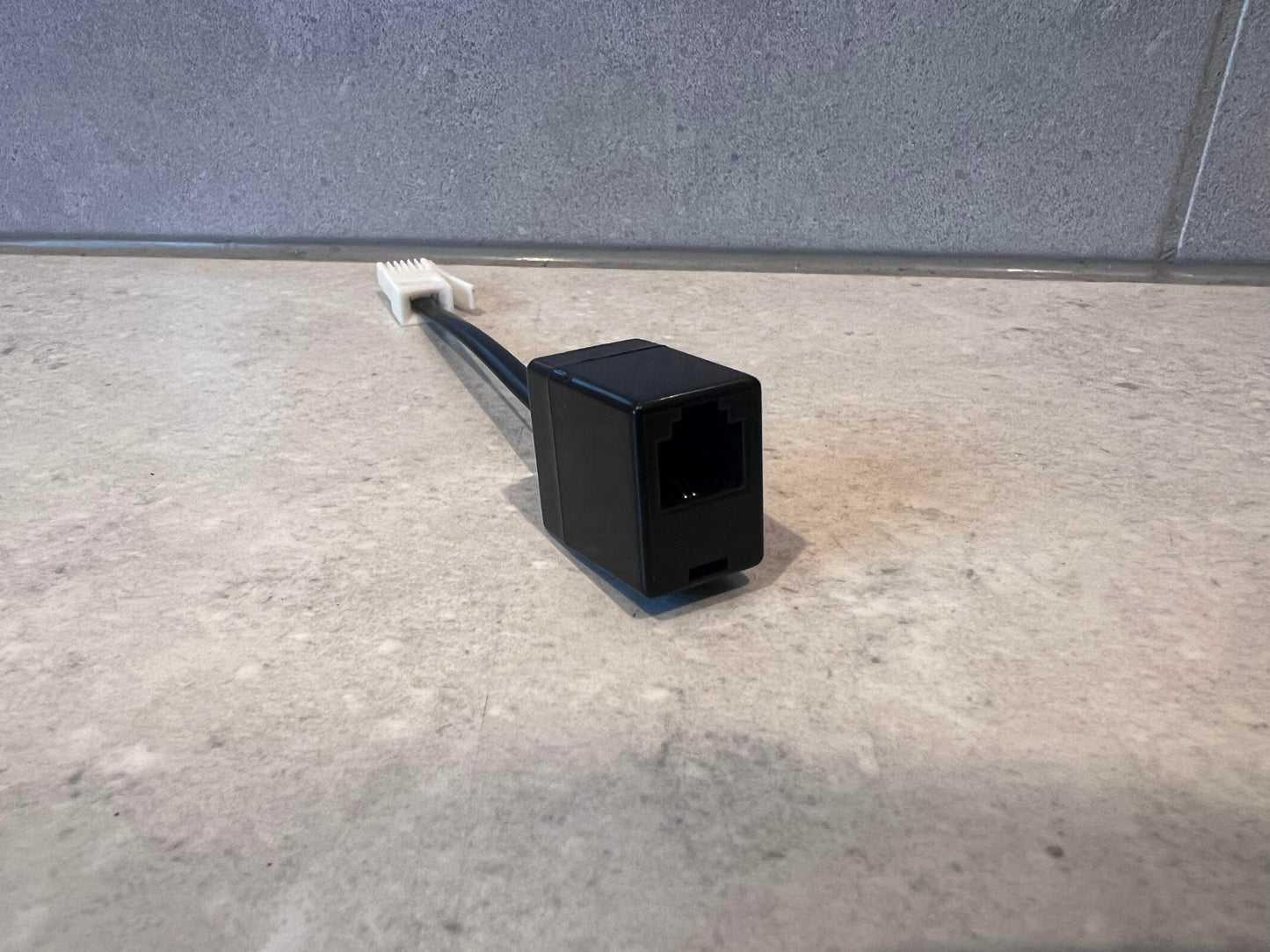 Close-up of Ethernet RJ45 female connector with attached cable