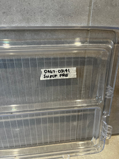 Close-up of label reading 'DA67-03141 SHELF FRF' on transparent refrigerator shelf bin
