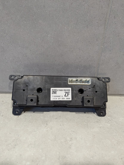 Rear view of automotive climate control panel assembly showing connector and product label