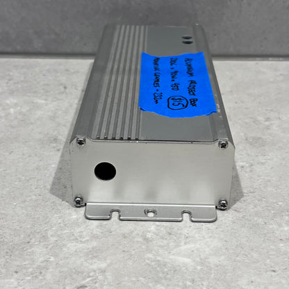 End view of aluminum project box displaying circular cutout and mounting brackets