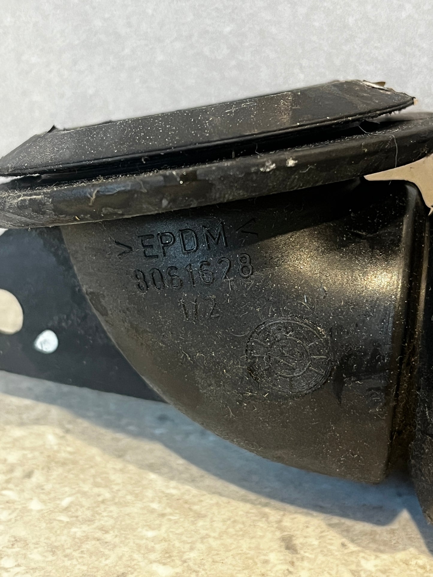 Close-up of EPDM marking and part number on automotive hose