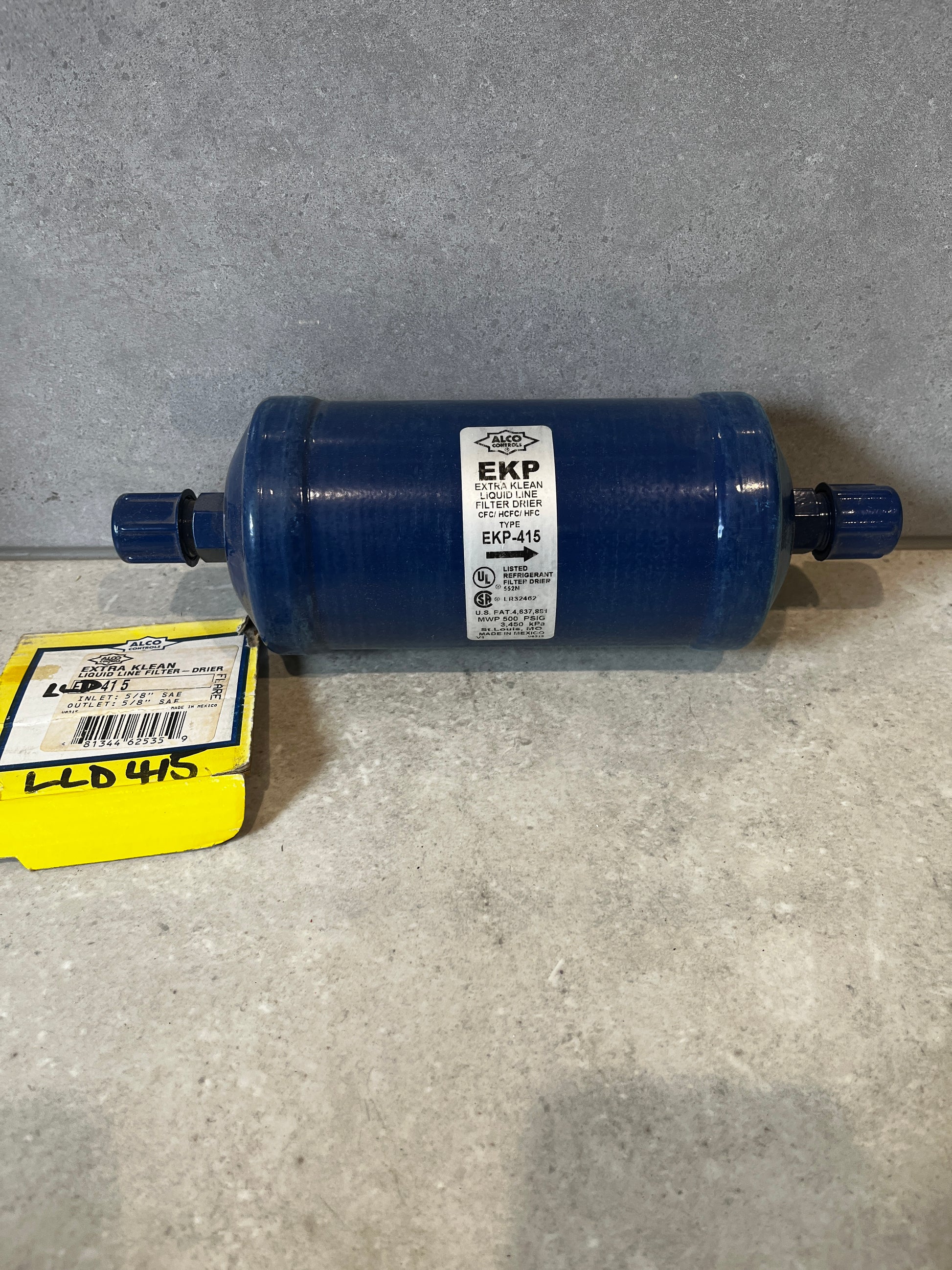 Alco EKP-415 Filter Drier with yellow box on countertop