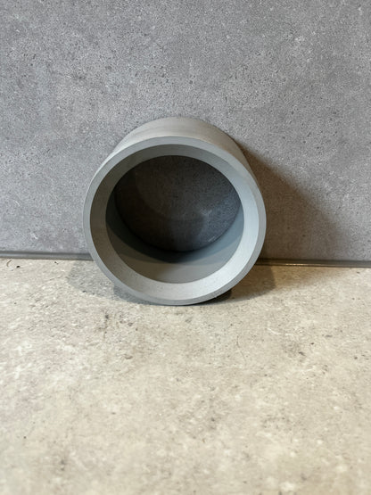 Gray PVC pipe coupling socket adapter angled rear view