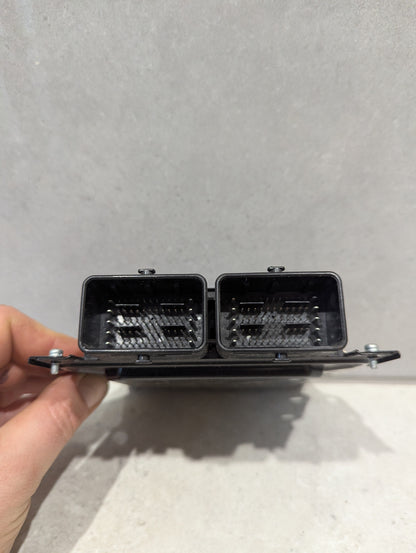 Connector side view of Nissan Engine Control Module 23740-4NL4A showing dual multi-pin connectors