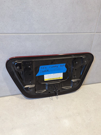 Rear view of Nissan Leaf ZE1 charge port cover showing mounting points