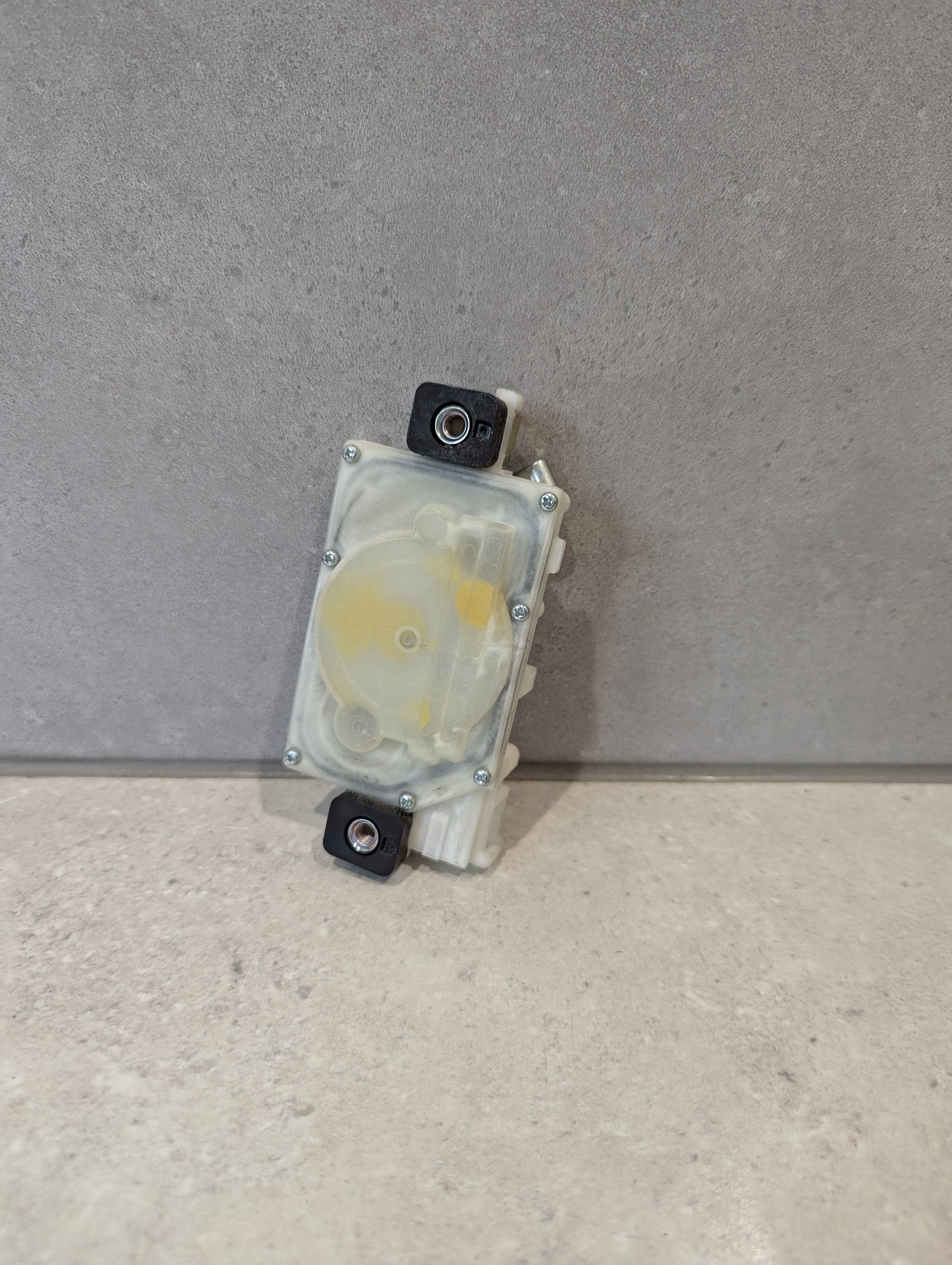 Rear view of Mitsuba door lock actuator showing gear mechanism