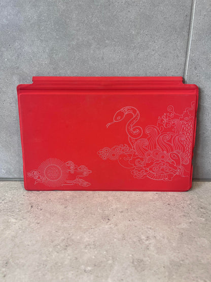 Back of Red Surface Touch Keyboard Cover featuring decorative pattern