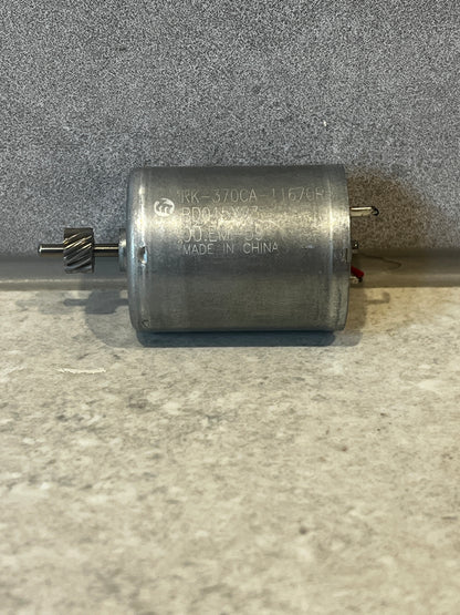 Top view of RK-370CA DC motor with engraved model number and electrical leads