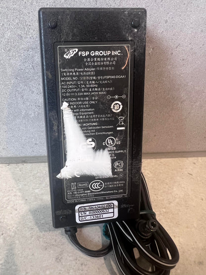 Close-up of FSP Group 12V 3.33A power adapter label and cable