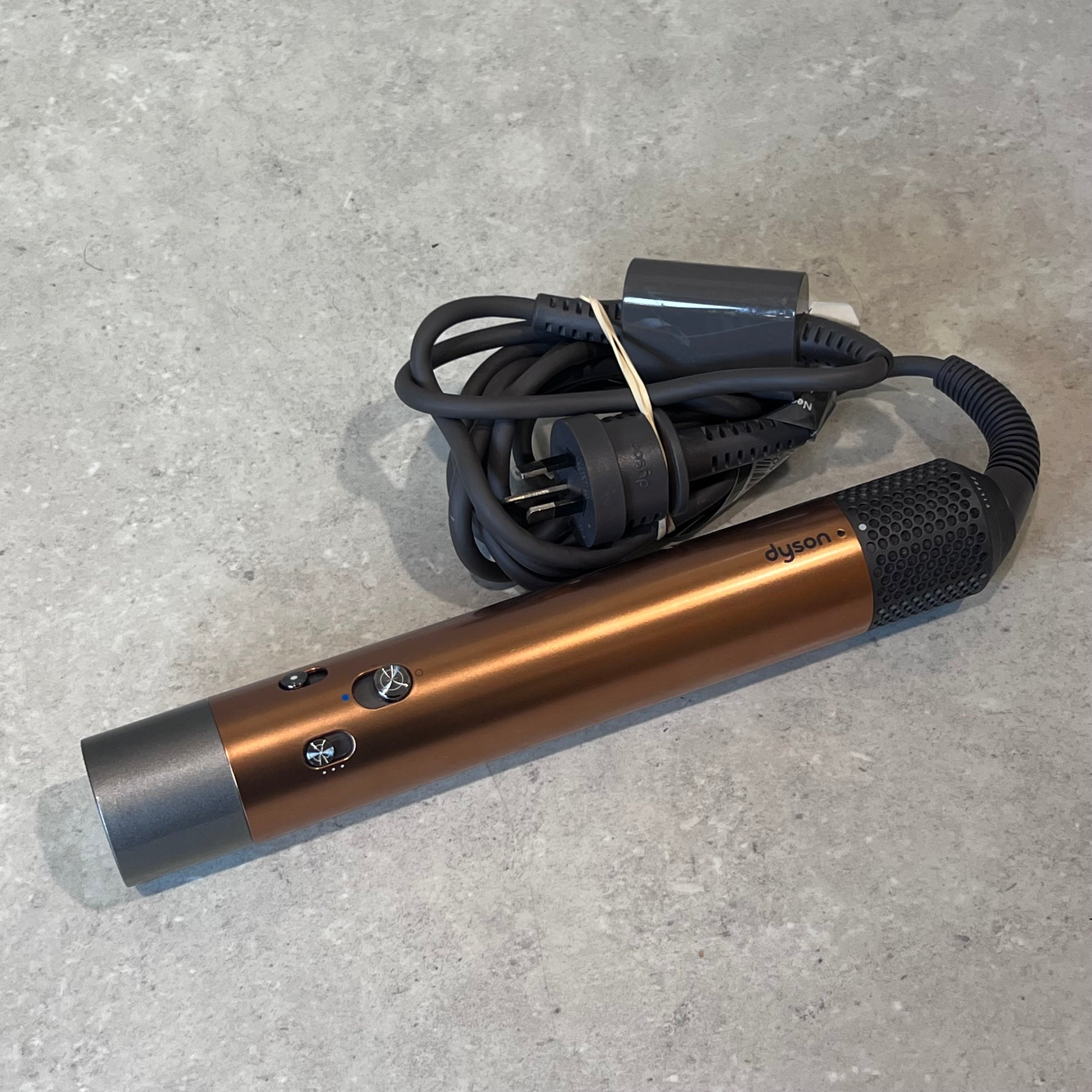 Dyson Airwrap main unit with attached power cord close-up