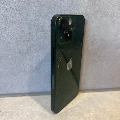 Side view of cracked green iPhone 13 Mini showing dual rear cameras and volume buttons