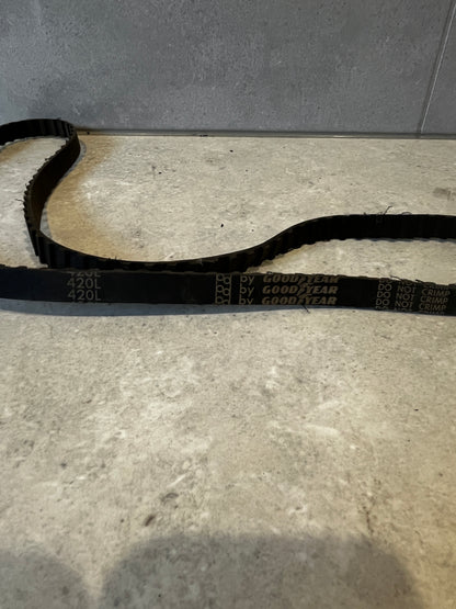 Close-up of Goodyear 420L timing belt showing text and teeth detail