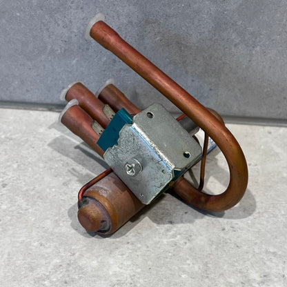 Angle view of Ranco VZ-40806-216 reversing valve with coil