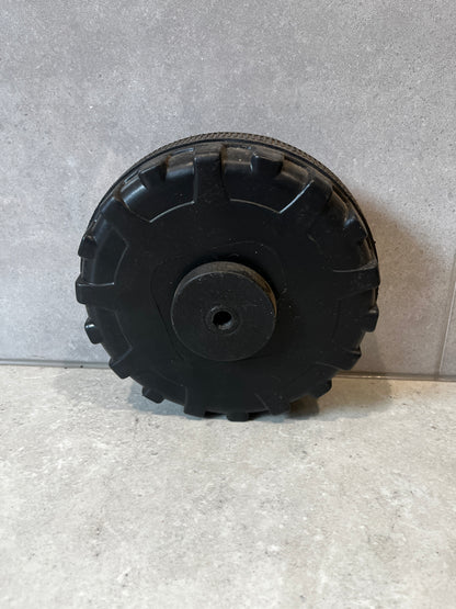 Rear view of sturdy black replacement wheel for utility wagon