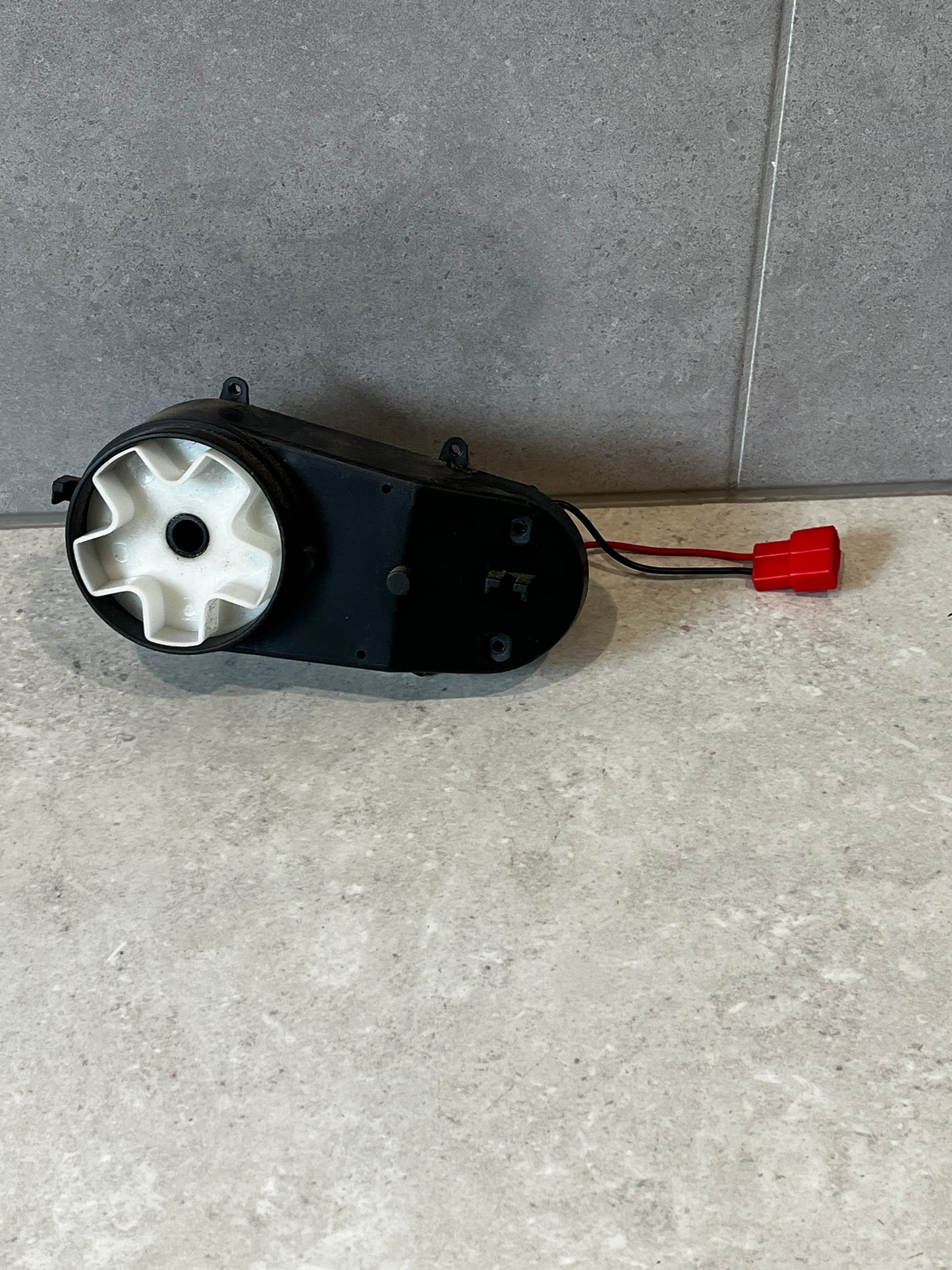 Top view of electric gearbox motor showing connector wires