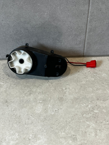 Top view of electric gearbox motor showing connector wires